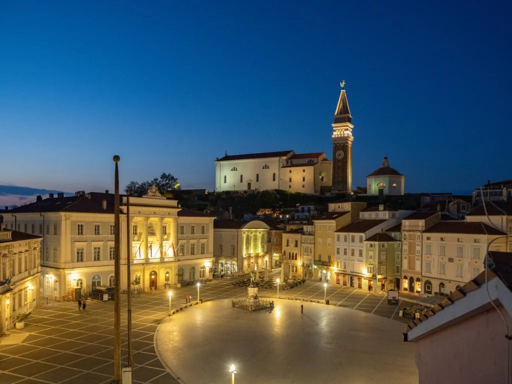 Tartini Square in Piran out of season, lit and empty in the evening