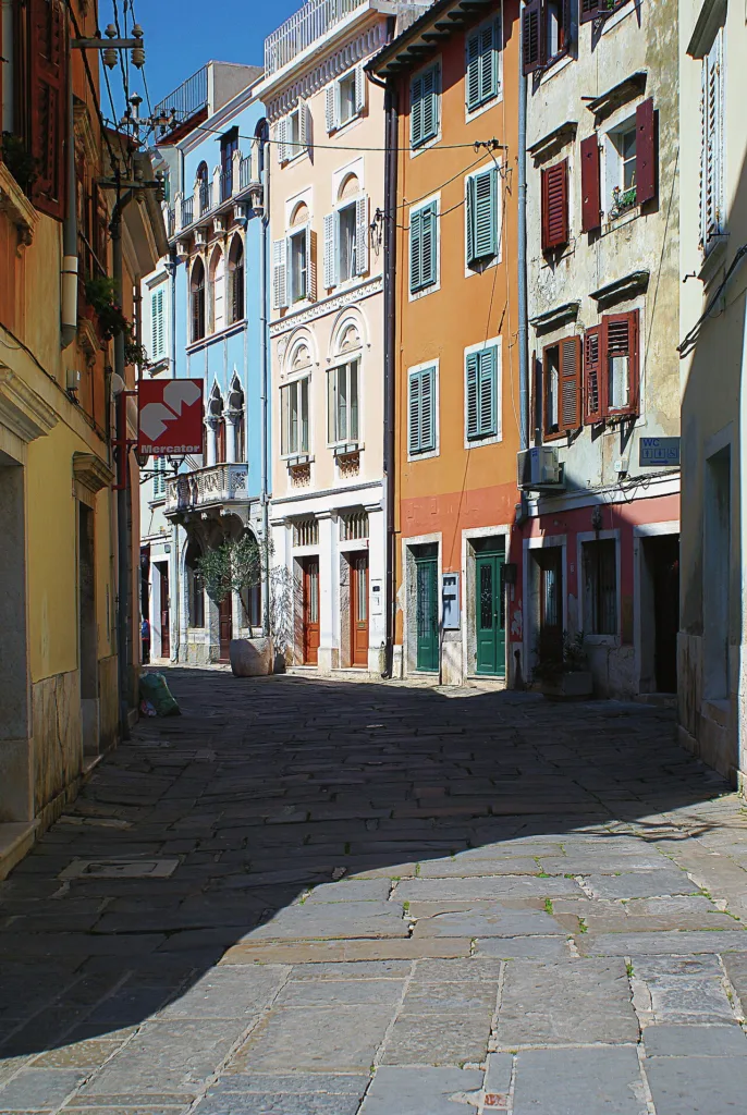 Narrow street in the old town of Piran, city game for company teams